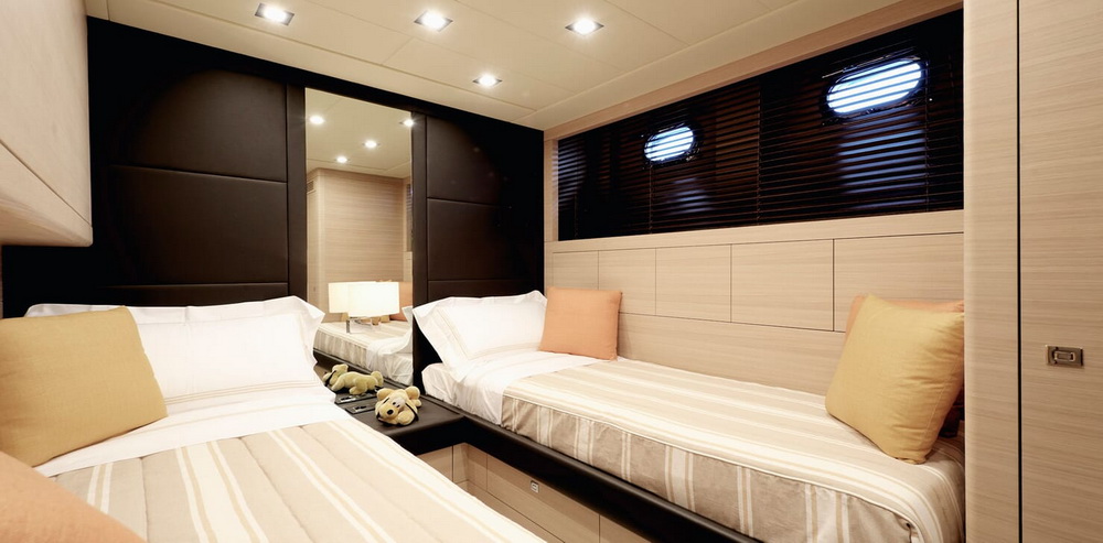 Motor yacht KAWAI twin stateroom with two single beds with low lighting